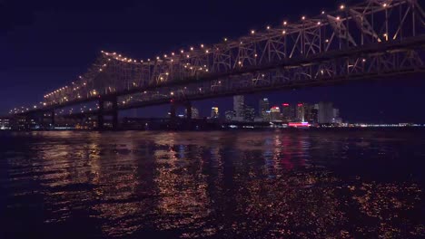 Beautiful-shot-of-the-Crescent-City-Bridge-at-night-with-New-Orleans-Louisiana-in-the-background-2