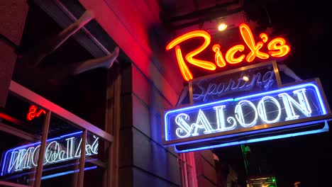 Neon-sign-for-Rick's-Saloon-on-Bourbon-Street-in-New-Orleans-at-night