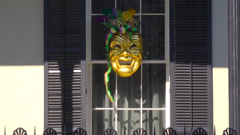 A-Mardi-Gras-mask-is-displayed-in-a-window-in-new-Orleans