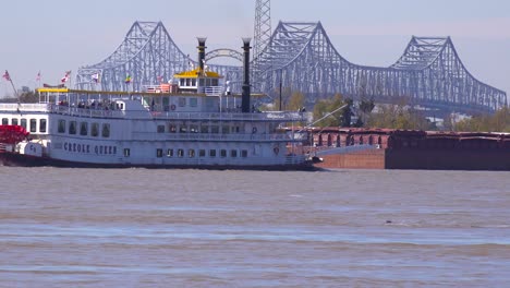 A-paddlewheel-steamboat-passes-on-the-Mississippi-River-with-new-Orleans-in-the-background-1