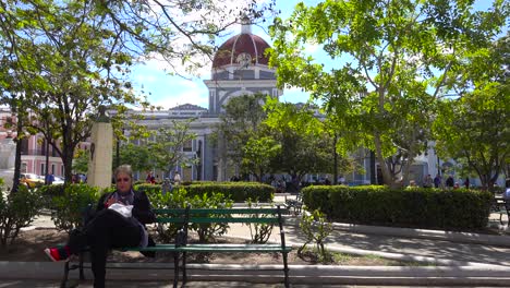 People-enjoy-a-sunny-day-in-the-park-in-Cienfuegos-Cuba