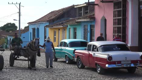A-beautiful-shot-of-the-buildings-and-cobblestone-streets-of-Trinidad-Cuba-with-horse-carts-passing-1