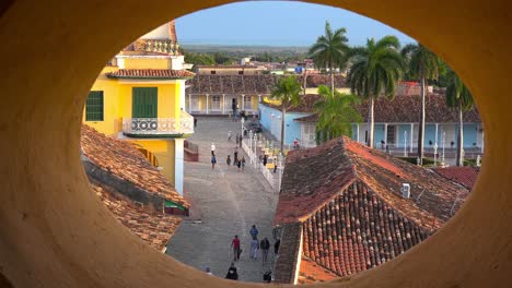 A-beautiful-view-of-the-quaint-and-charming-city-of-Trinidad-Cuba-through-a-porthole-in-the-church-steeple