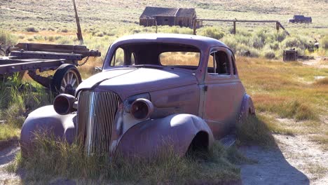 An-old-car-from-another-era-sits-in-the-fields-in-the-abandoned-ghost-town-of-Bodie-California