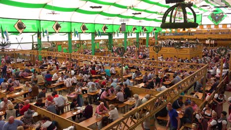 Establishing-shot-of-a-crowded-beer-hall-during-Oktoberfest-in-Munich-Germany