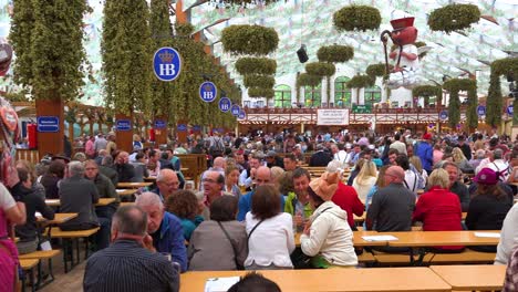 A-woman-sells-gingerbread-cookies-inside-a-beer-hall-at-Oktoberfest-Germany