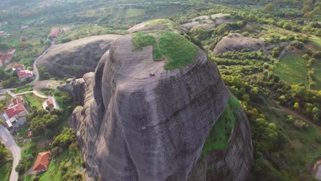 Beautiful-aerial-as-climbers-summit-a-sheer-rocky-cliff-face-in-Meteora-Greece-2