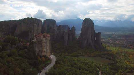 Beautiful-aerial-in-golden-light-over-the-rock-formations-of-Meteora-Greece-2