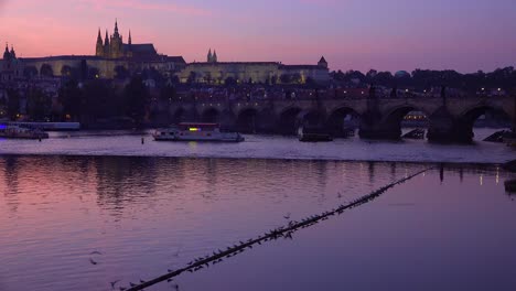 Beautiful-sunset-establishing-shot-of-shoreline-of-the-Vltava-River-in-Prague-Czech-Republic
