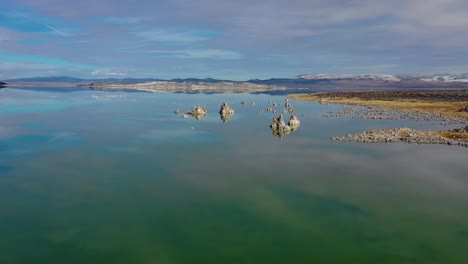 Beautiful-and-inspiring-nature-drone-aerial-over-Mono-Lake-in-winter-with-perfect-reflection-tufa-outcropping-in-the-Eastern-Sierra-Nevada-mountains-in-California-2