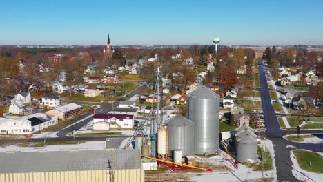 A-drone-aerial-over-a-small-town-in-America-in-winter-snow-Riverside-Iowa
