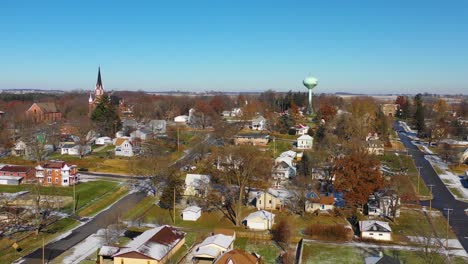 A-drone-aerial-over-a-small-town-in-America-in-winter-snow-Riverside-Iowa-1