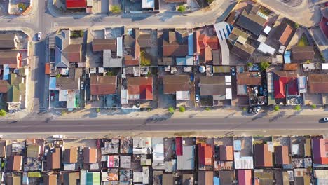 Straight-down-high-aerial-contrasting-neighborhoods-above-ramshackle-township-of-Gugulethu-one-of-the-poverty-stricken-slums-ghetto-or-townships-of-South-Africa