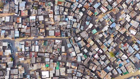 Straight-down-circular-high-aerial-above-ramshackle-township-of-Gugulethu-one-of-the-poverty-stricken-slums-ghetto-or-townships-of-South-Africa