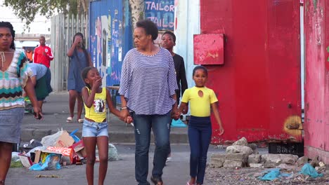 People-pedestrians-and-cars-on-the-busy-downtown-streets-of-a-South-African-township-ghetto-or-slum-Gugulethu-3