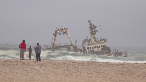 A-spooky-shipwreck-grounded-fishing-trawler-sits-in-Atlantic-waves-along-the-Skeleton-Coast-of-Namibia-3