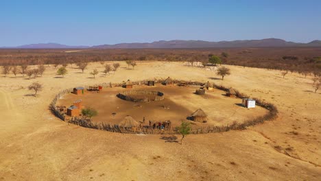 Beautiful-aerial-over-a-round-Himba-African-tribal-settlement-and-family-compound-in-northern-Namibia-Africa-2