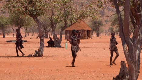 Small-poor-African-Himba-village-on-the-Namibia-Angola-border-with-mud-huts-and-children-1