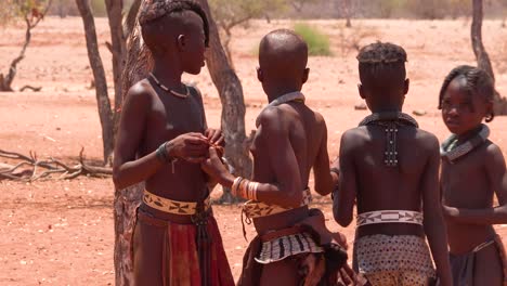 Poor-African-niños-play-games-and-sports-with-a-ball-in-a-Himba-village-on-the-Namibia-Angola-border-1