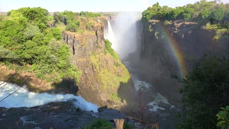 Beautiful-establishing-shot-with-rainbow-of-Victoria-Falls-from-the-Zimbabwe-side-of-the-African-waterfall-1
