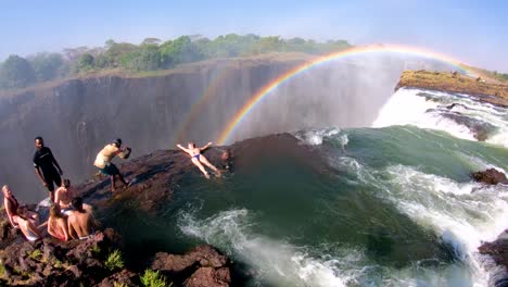 Tourists-gather-at-Devil's-Pool-the-edge-of-Victoria-Falls-Zambia-for-a-glimpse-over-the-edge-of-the-waterfalls-3