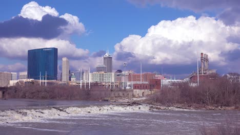 Beautiful-establishing-shot-of-Indianapolis-Indiana-with-big-storm-clouds-and-the-White-Río-foreground-1