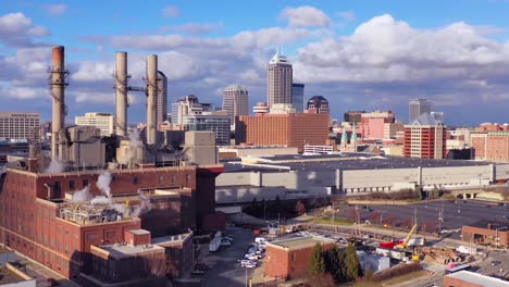 Nice-drone-aerial-of-downtown-Indianapolis-Indiana-with-industrial-factory-in-foreground
