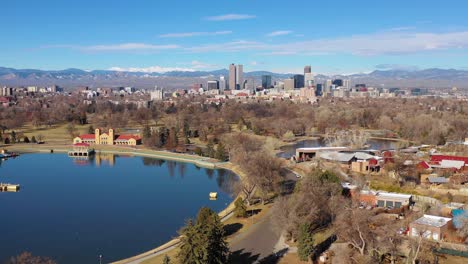 Good-stationary-aerial-of-downtown-Denver-Colorado-skyline-from-large-lake-at-City-Park