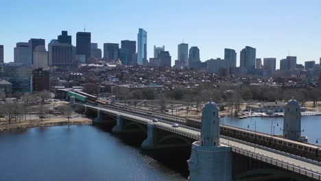 Aerial-establishing-city-skyline-of-Boston-Massachusetts-with-Longfellow-bridge-and-subway-train-crossing-3