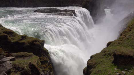 Pan-across-the-massive-Gulfoss-waterfall-flowing-in-Iceland