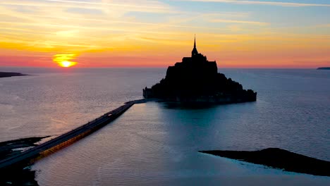 Amazing-aerial-of-Mont-Saint-Michel-France-silhouetted-at-sunset