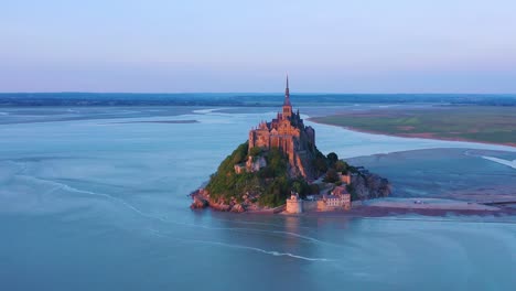 Beautiful-aerial-shot-of-Mont-Saint-Michel-in-Normandy-France-in-sunset-light