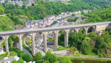 Aerial-over-the-pretty-town-of-Dinan-France-with-highway-bridge