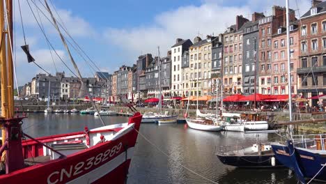 Beautiful-establishing-of-Honfleur-France-with-old-colorful-buildings-and-cafes-2