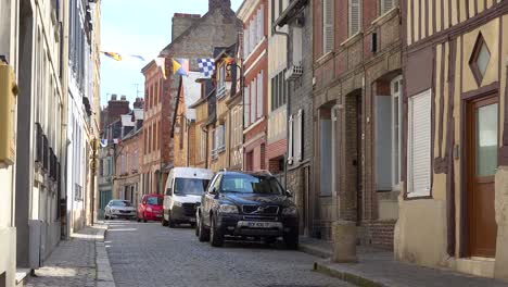 Old-cobblestone-street-and-traditional-stone-buildings-in-the-pretty-town-village-of-Honfleur-France-1