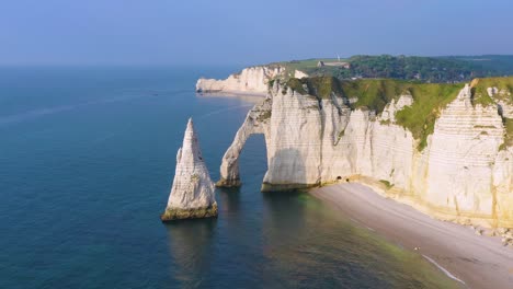 Nice-aerial-around-white-limestone-cliffs-and-arches-at-Etretat-France-English-Channel-1