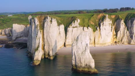 Nice-aerial-around-white-limestone-cliffs-and-arches-at-Etretat-France-English-Channel-2