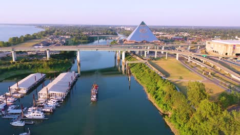 Aerial-over-Memphis-Tennessee-waterfront-and-Mud-Island-with-Memphis-pyramid-background