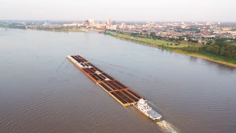 Good-aerial-over-the-Mississippi-River-and-barge-revealing-Memphis-Tennessee-background
