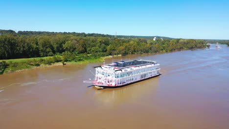 Beautiful-aerial-shot-of-a-paddlewheel-steamboat-luxury-cruise-ship-on-the-Mississippi-River