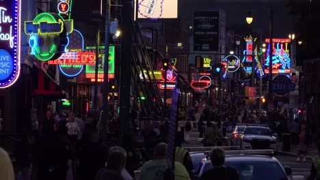 Establishing-night-and-crowds-on-Beale-Street-Memphis-Tennessee-with-neon-signs-bars-and-clubs