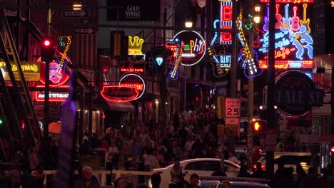 Establishing-night-and-crowds-on-Beale-Street-Memphis-Tennessee-with-neon-signs-bars-and-clubs-2