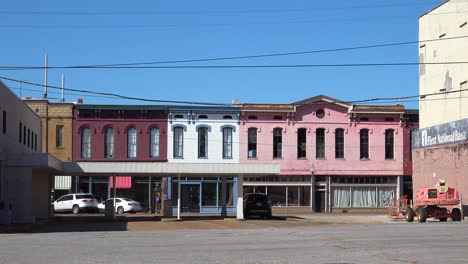 People-walk-through-a-rundown-and-poverty-stricken-abandoned-America-town-in-Mississippi