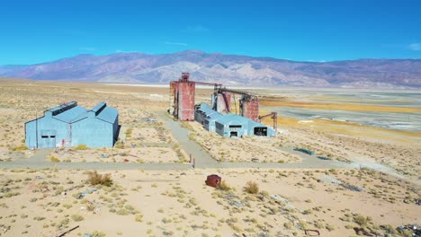 Aerial-over-an-abandoned-glass-factory-plant-along-highway-395-at-Owens-Lake-Owens-Valley-California
