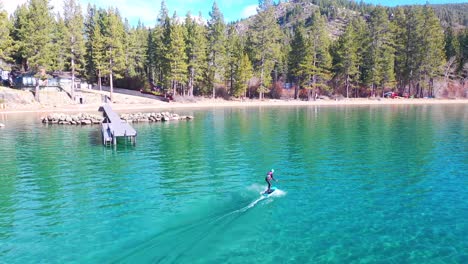 2020---a-man-rides-a-hydrofoil-efoil-electronic-surfboard-across-Lake-Tahoe-California-in-an-extreme-hydrofoiling-foil-sport-demonstration-2