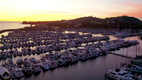 2020---dusk-or-twilight-aerial-over-Santa-Barbara-harbor-with-many-boats-at-dock