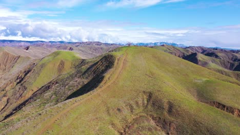 2020---aerial-over-the-pacific-coastal-green-hills-and-mountains-behind-Ventura-California-including-Two-Trees-landmark