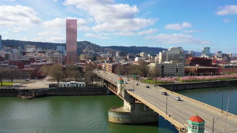 Aerial-over-Burnside-Bridge-Portland-Oregon-stag-deer-sign-and-downtown-old-town-cityscape-and-business-district