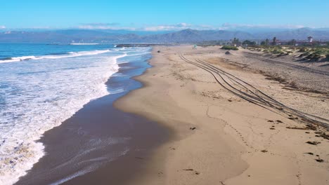 2020---aerial-of-closed-lifeguard-station-and-abandoned-beaches-of-Ventura-southern-california-during-covid-19-coronavirus-epidemic-as-people-stay-home-en-masse