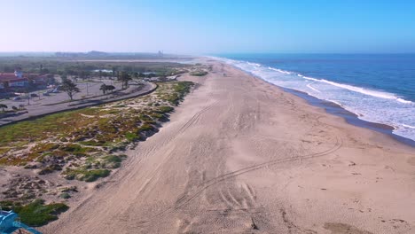 2020---aerial-of-closed-lifeguard-station-and-abandoned-beaches-of-Ventura-southern-california-during-covid-19-coronavirus-epidemic-as-people-stay-home-en-masse-2